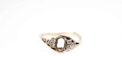 A ring set in 9 carat yellow gold