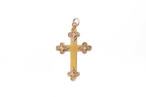 An ornate cross in 9 carat yellow gold