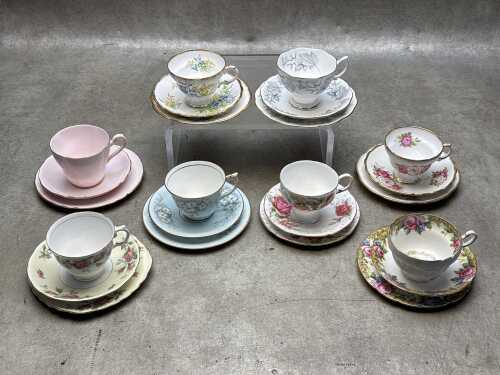 Eight English porcelain trios