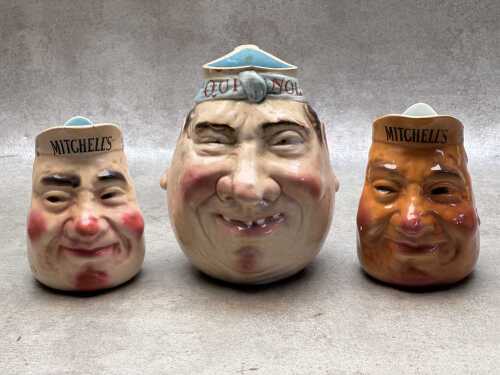 Three advertising ceramic character jugs