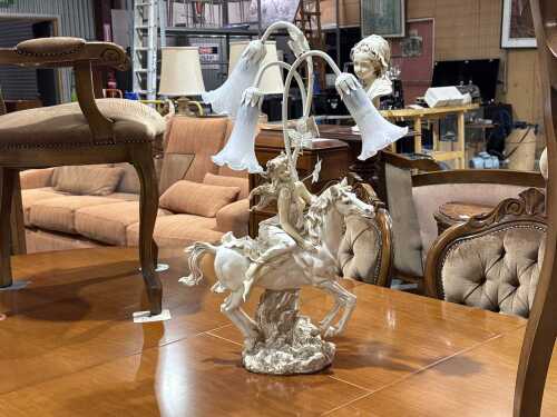 The Milano Collection figural woman on a horse lamp with tulip shades.