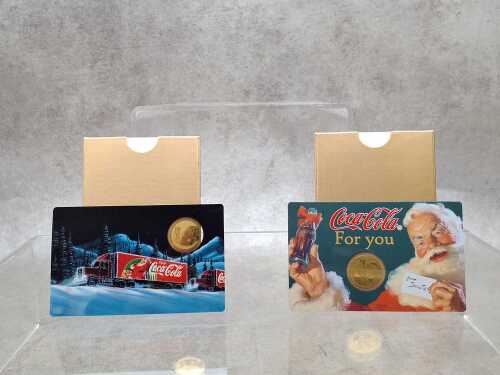 Two Coca-Cola Santa 1/1000 OZ 999 gold coin 3000 Francs