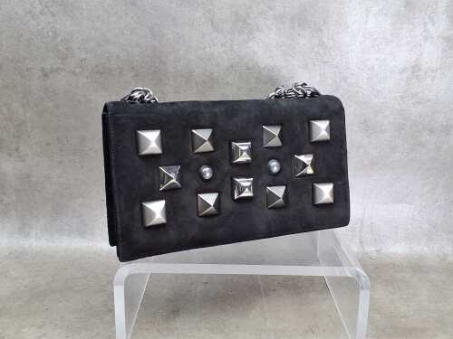 Designer-style clutch black suede bag with silver tone pyramid studs.