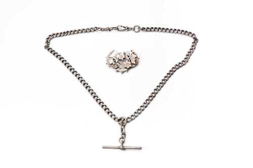 An antique brooch and fob necklace in sterling silver