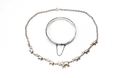 An elephant necklace and enamel bangle in sterling silver