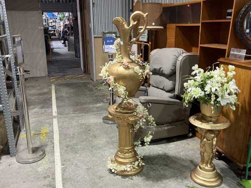 Gold tone urn on pedestal