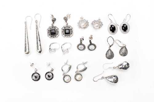 A collection of earrings in sterling silver