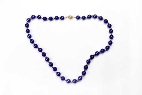 A lapis lazuli necklace with 14 carat clasp and 9 carat spacers