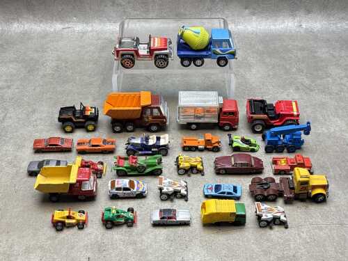 A group of mostly die-cast cars