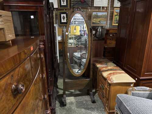 An oval cheval mirror
