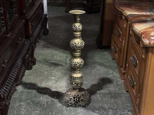 Tall pierced brass candle holder