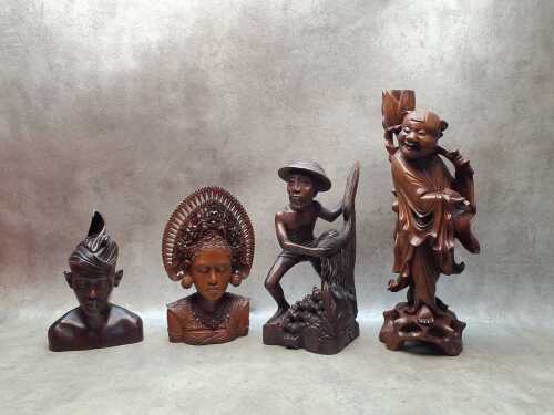 Four decorative hand-carved timber figures
