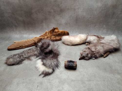Three fur stoles and a snakeskin