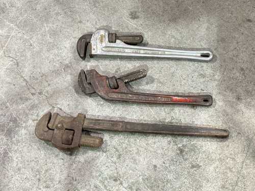 Three heavy-duty pipe wrenches