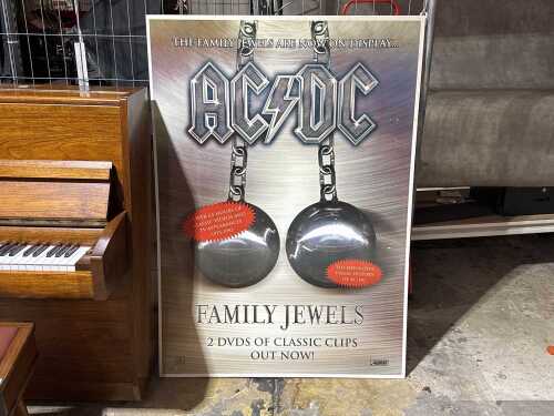AC/DC Family Jewels promotional poster on board and DVD