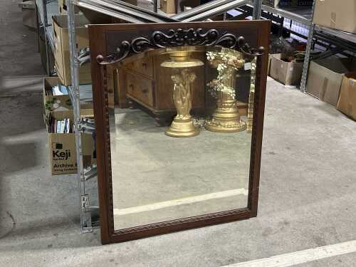 Antique timber-framed mirror with carved floral header