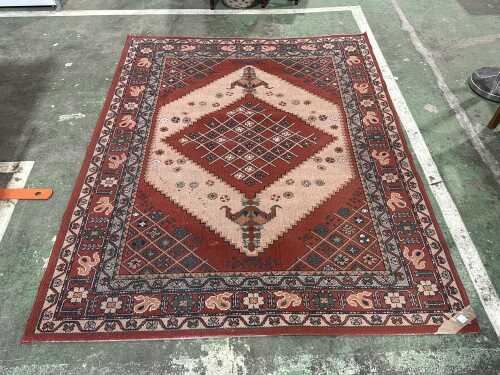 Red and pink power loomed rug
