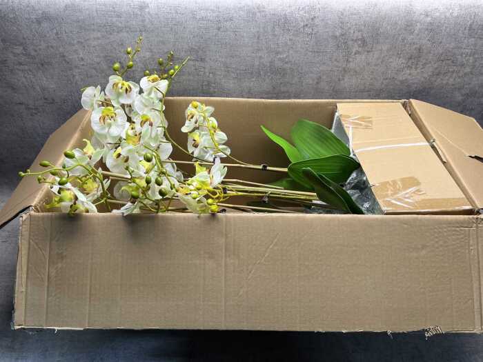 Artificial orchid plant in pot