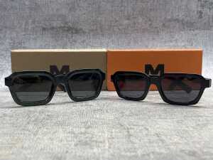 Two pairs of Meller sunglasses