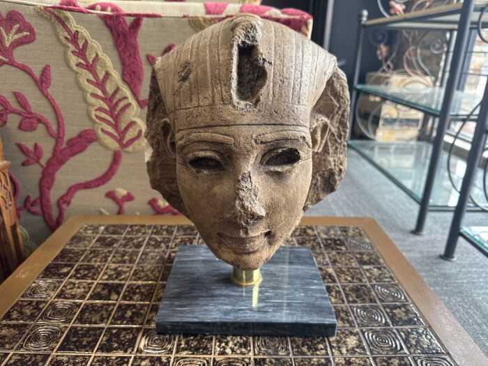 Reproduction bust of Tutankhamen on a stone base