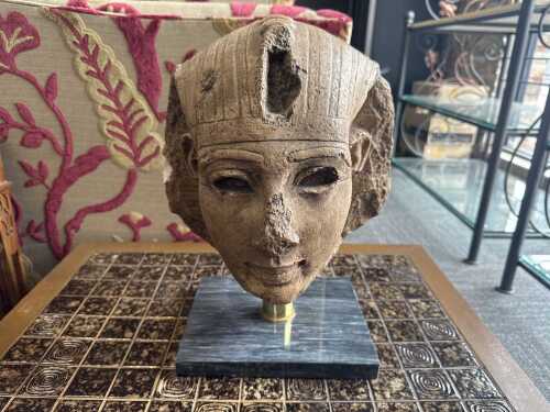 Reproduction bust of Tutankhamen on a stone base
