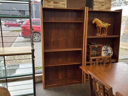 A contemporary live edge hardwood bookcase (left)