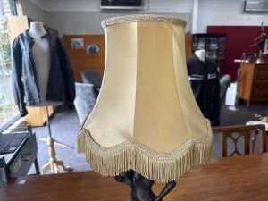 Cast metal figural lamp with caramel fringed fabric shade - 3