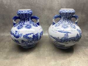 Pair of blue and white porcelain twin-handled gourd vases