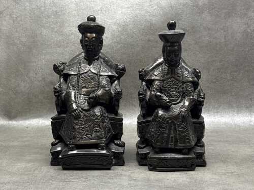 Pair of bronzed resin Chinese seated Emperor and Empress figures