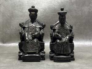 Pair of bronzed resin Chinese seated Emperor and Empress figures