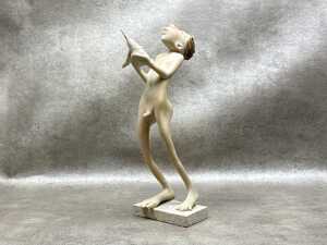 Whimsical resin figure of a boy and a bird on base