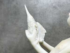 Whimsical resin figure of a boy and a bird on base - 4