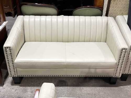 Contemporary cream upholstered two-seater sofa