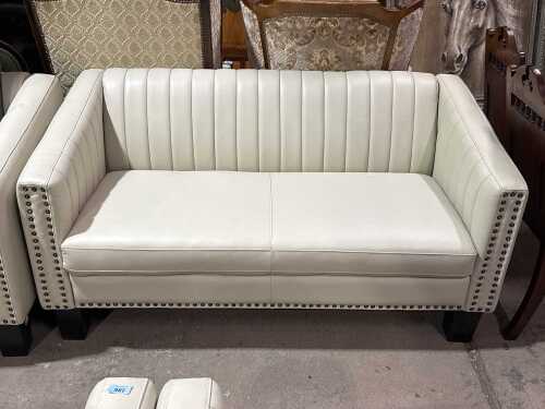 Contemporary cream upholstered two-seater sofa