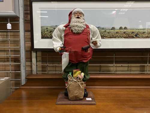 Vintage workshop Santa with a sack of toys