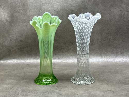 Two vintage Northwood Vaseline-patterned vases with ruffled rims.