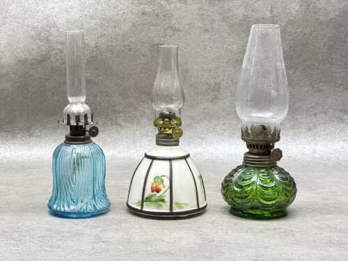 Three miniature kerosene lamps
