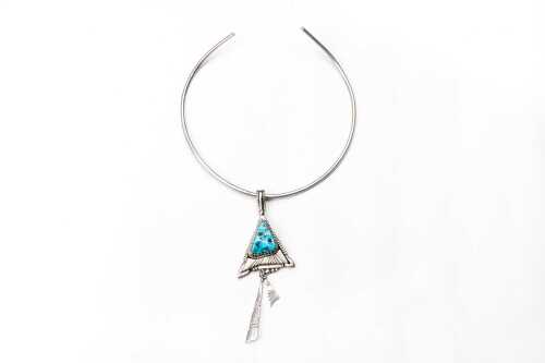 A turquoise pendant on torc in sterling silver