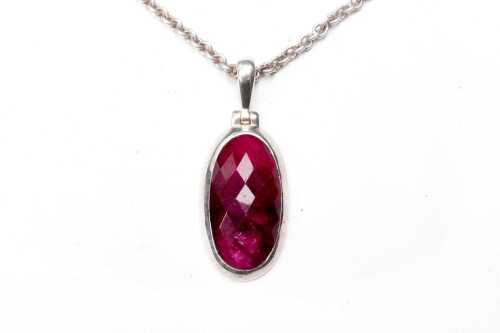 A ruby pendant and necklace in sterling silver