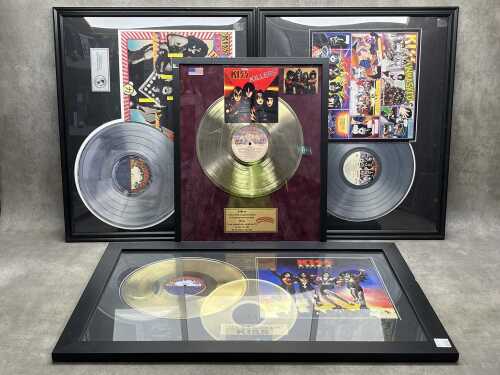 Four decorative framed KISS memorabilia album montages