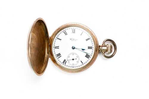 An antique rolled gold Waltham pocket watch