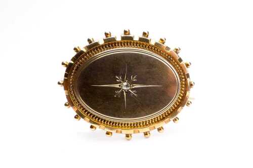 A Victorian rolled gold diamond mourning locket/brooch.