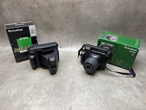 Two Fujifilm instant cameras