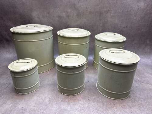 Six vintage metal nesting storage tins