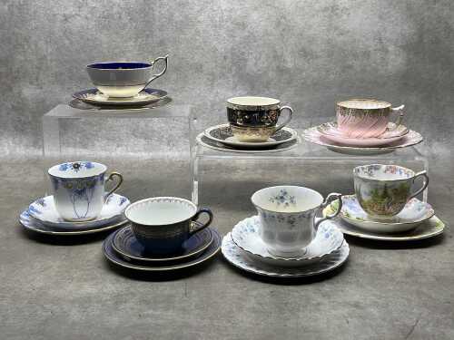 Seven English porcelain trios
