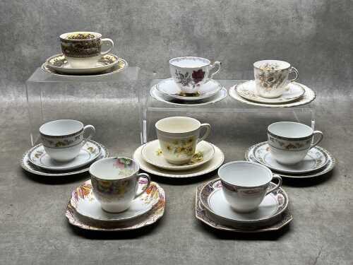 Eight vintage porcelain trios