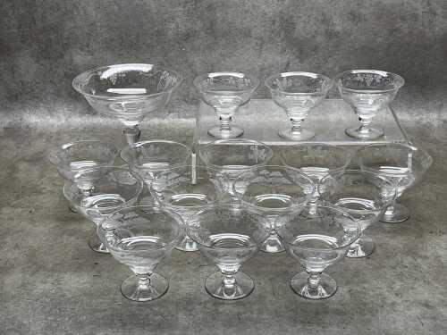 Stuart crystal footed dessert bowls with various etched designs.