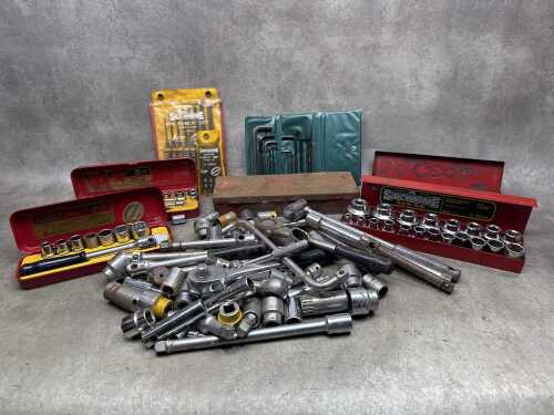 Various sockets and sockets sets with a pin punch set