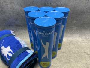 Group of tennis balls & towel - 2