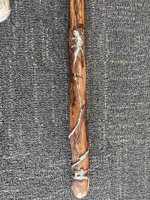 Jerome Lyons, carved timber rainstick with applied pewter lizard, 2004.